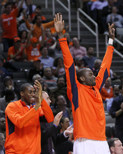 Matt Lyde-Cajuste #14 (L) and Baye Moussa-Keita #12 (R) of the Syracuse Orange celebrate after a play against the Montana Grizzlies.