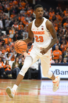 Syracuse guard Frank Howard drives the ball down the court. Frank Howard shot 4-of-10 with nine points in the win.