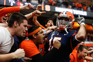 Syracuse wide receiver Alec Lemon celebrates with fans after the Orange's 45-26 win over Louisville Saturday. Lemon finished with nine catches for 176 yards and two touchdowns.