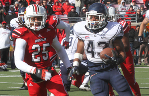 Lyle McCombs and Connecticut defeated Louisville 23-20 in triple overtime on Saturday. The Huskies (5-6) need a win against Cincinnati this week to earn bowl eligibility. 