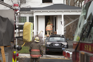 Syracuse firefighters enter 773 Ostrom Ave. where a small fire broke out Monday afternoon. No one was injured but the five residents had to find somewhere else to spend the night.