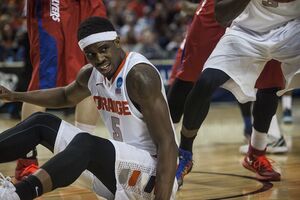 C.J. Fair pushes himself off the ground in Syracuse's 55-53 loss to Dayton on Saturday. The defeat ended the Orange's season, and the senior forward's illustrious collegiate career. 