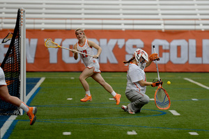 Kelsey Richardson drops to a knee on the Carrier Dome turf on Sunday. She turned in an improved performance from last weekend, guiding SU to a 19-7 win over Canisius.