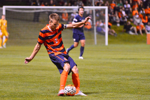 Oyvind Alseth distributes a ball Friday night against Pitt. The junior had three assists in SU's 5-0 win.