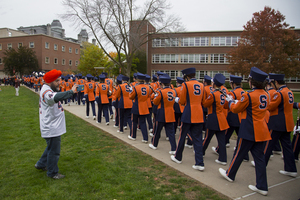 The band playing on the quad is one key tradition before games. They also play at Varsity after wins and flip a banner with the opposing team's name on it. 