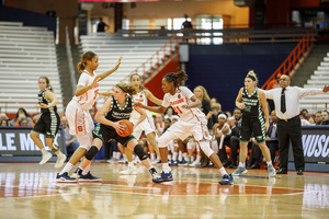 Kadiatou Sissoko (left) and Gabrielle Douglas trap a North Dakota ball handler during the first game of SU's season.