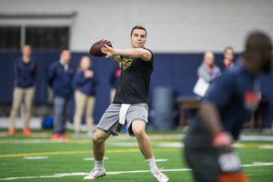 Eric Dungey passes the ball during Syracuse's pro day.