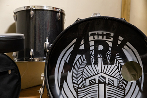 A drum set is decorated by the logo for The Ark, a popular underground performance venue that is ending its two-year career. 