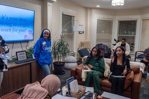 Kayla Turner, peer educator at the Barnes Center, discusses thriving strategies with participants of the event. At 119 Euclid, Kayla Turner and Kelvin Boakye gave a presentation on mental health and identity focused on the African American community.