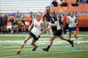 Christina Dove (12) had scored a goal in 50 consecutive games before Syracuses 6-5 loss to No. 11 Notre Dame last Sunday. On the 2010 season, Dove leads the Orange with 40 goals, and she is the active Division I leader in goals scored (221) and points (292).