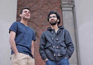 (From Left) Ismail Pathan and Azhar Ali, members of SUs Muslim Student Association, enjoy interacting with students and gathering opinions about Muslims and Islam.