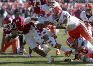 Jay Bromley (96) attempts to bring down Temple quarterback Juice Granger.