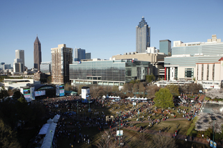 A view of Centennial Park in Atlanta, a day before the NCAA matchup between Syracuse and Michigan. Fans gather to celebrate and listen to live music.