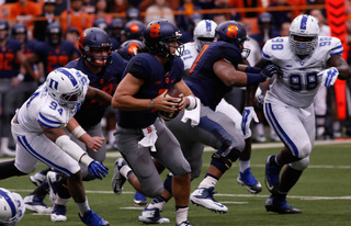 Sophomore quarterback Austin Wilson escapes pressure as he looks to make a pass. Wilson started the game with AJ Long out with a nerve issue. 