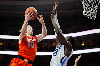 Cooney attacks the rim during the second half. The junior had 17 points on 4-of-12 shooting on the afternoon.