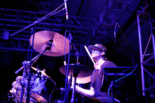 Rob Chafin, drummer for The Werks, plays his drum set as part of the opening act. 