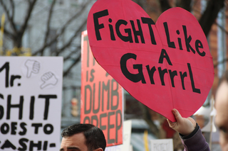 A sign in the Syracuse march reads 