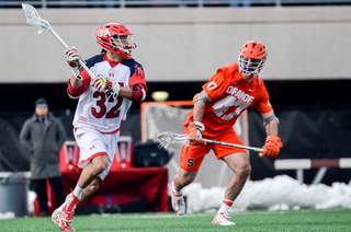 Joe Gillis chases down St John's Zach Larsen. 