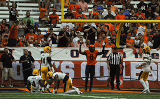 Steve Ishmael signals touchdown standing close to the endzone. Ishmael finished with eight catches and 139 yards. 