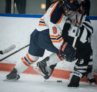 Allie Munroe hits a Providence player.