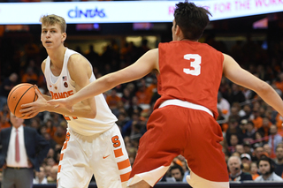 Syracuse forward Marek Dolezaj looks to pass the ball to an open teammate.