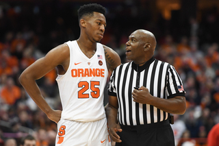 Syracuse guard Tyus Battle talks with an official.