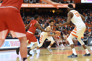 Syracuse guard Howard Washington drives the ball down court.