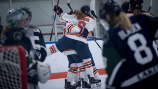 Syracuse celebrates one of its four goals. 