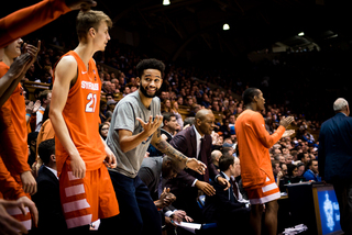 Point guard Howard Washington celebrates a big SU play. 